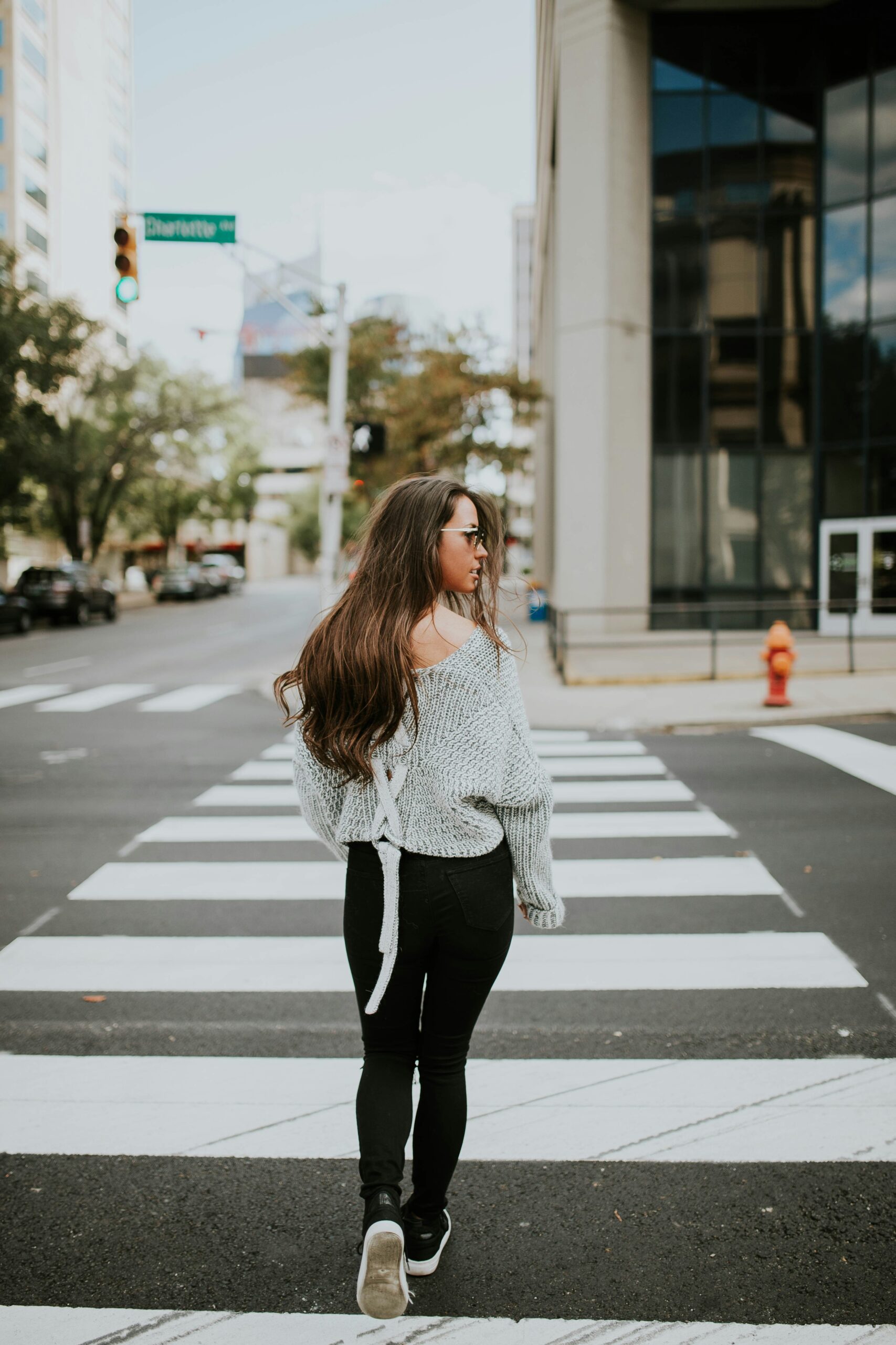 Woman crossing an intersection in New York City